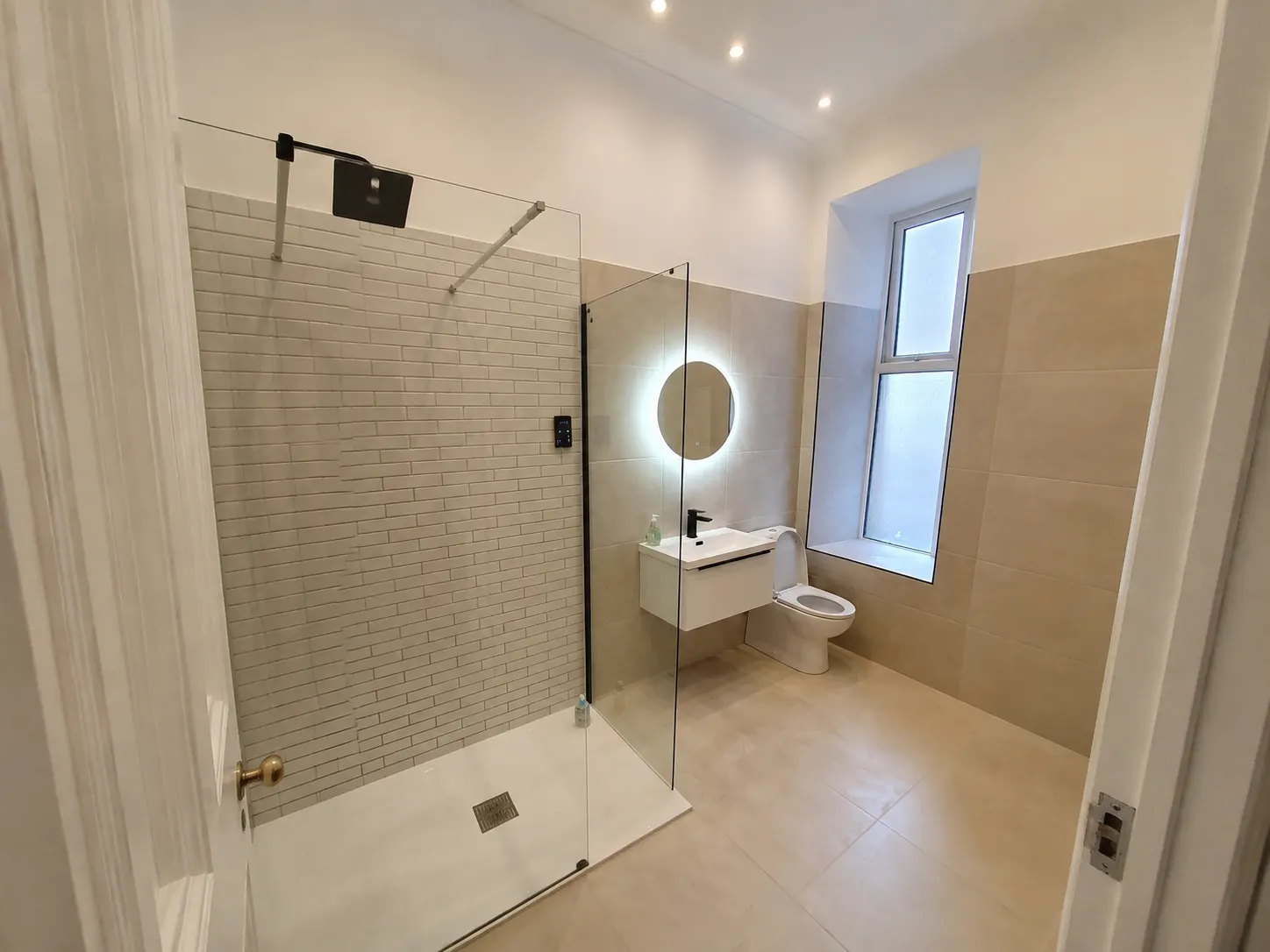 Newly fitted bathroom with tiled walls by Carpathian Craft in Edinburgh