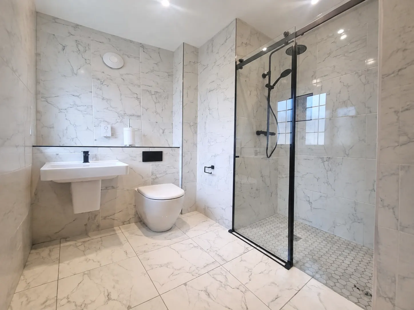 Bathroom with wall tiling and screen fitted in Edinburgh