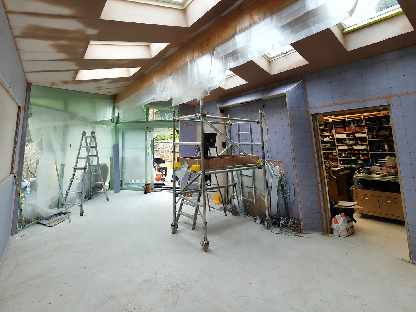 Room mid-renovation with fresh plaster in an Edinburgh property